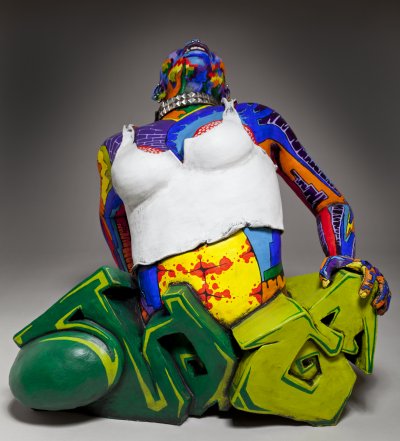 front shot of ceramic sculpture of punk chick with colorful surface decorati